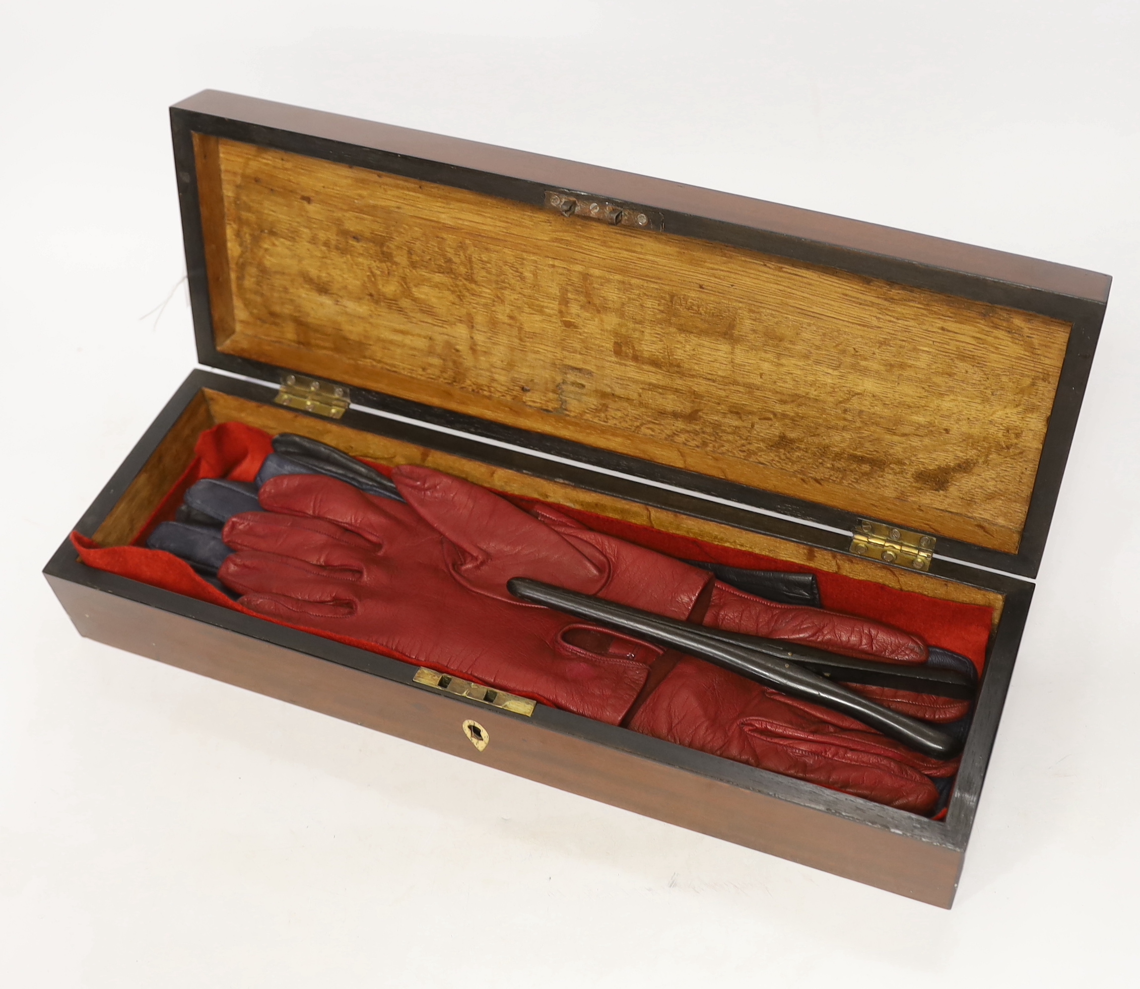A 19th century mahogany glove box, three pairs of kid leather gloves and a rosewood tea caddy with bone escutcheon, glove box 40cm wide